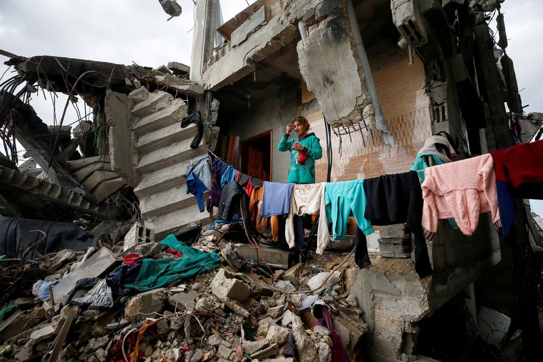 A Palestinian girl looks out from the ruins of her family's destroyed house where she takes shelter, in Jabalia refugee camp in the northern Gaza Strip on February 13.