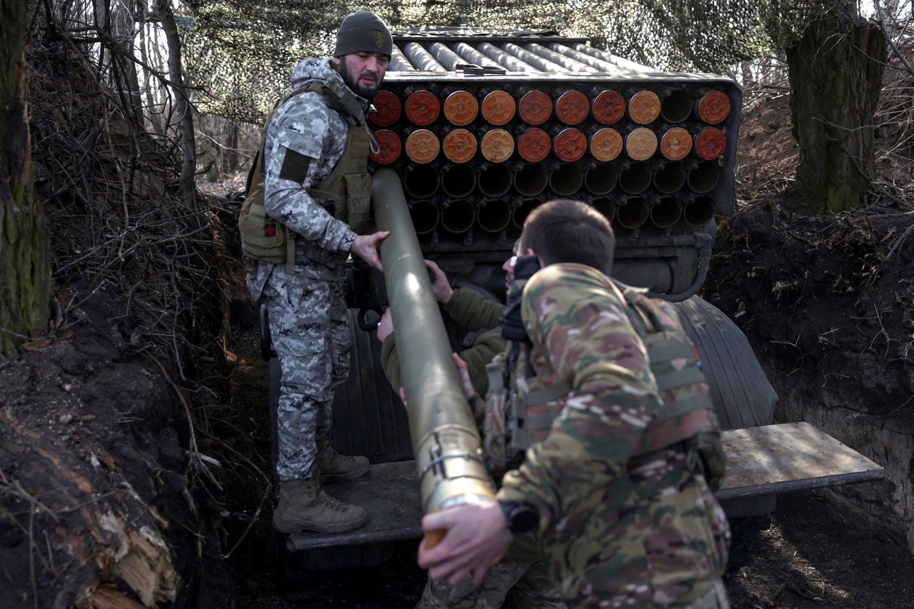 Ukrainian service members load a rocket into a BM-21 Grad multiple launch system near the frontline town of Pokrovsk, in Donetsk region, Ukraine, on Friday.