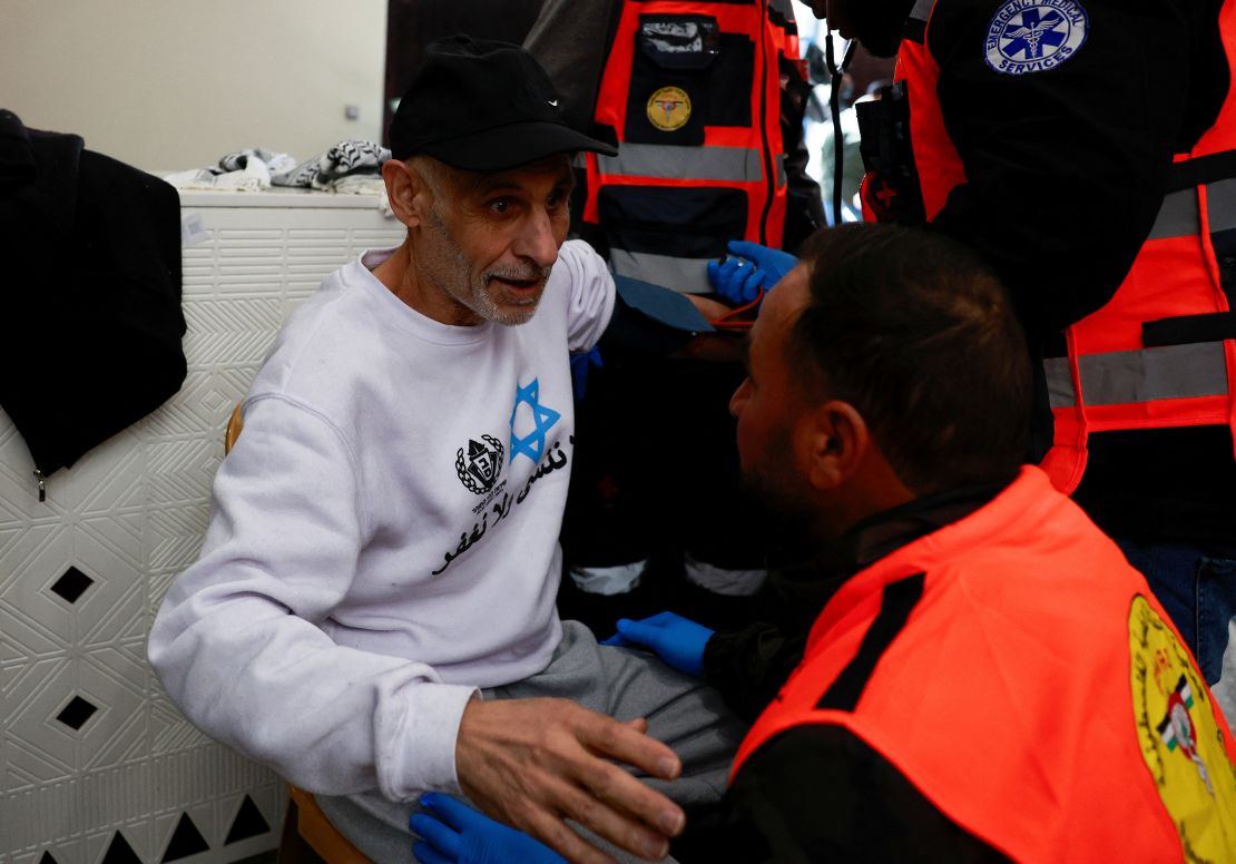 A medic aids a freed Palestinian prisoner after being released from an Israeli jail as part of a hostages-prisoners swap and a ceasefire deal in Gaza between Hamas and Israel, in Ramallah, in the Israeli-occupied West Bank on February 15, 2025.