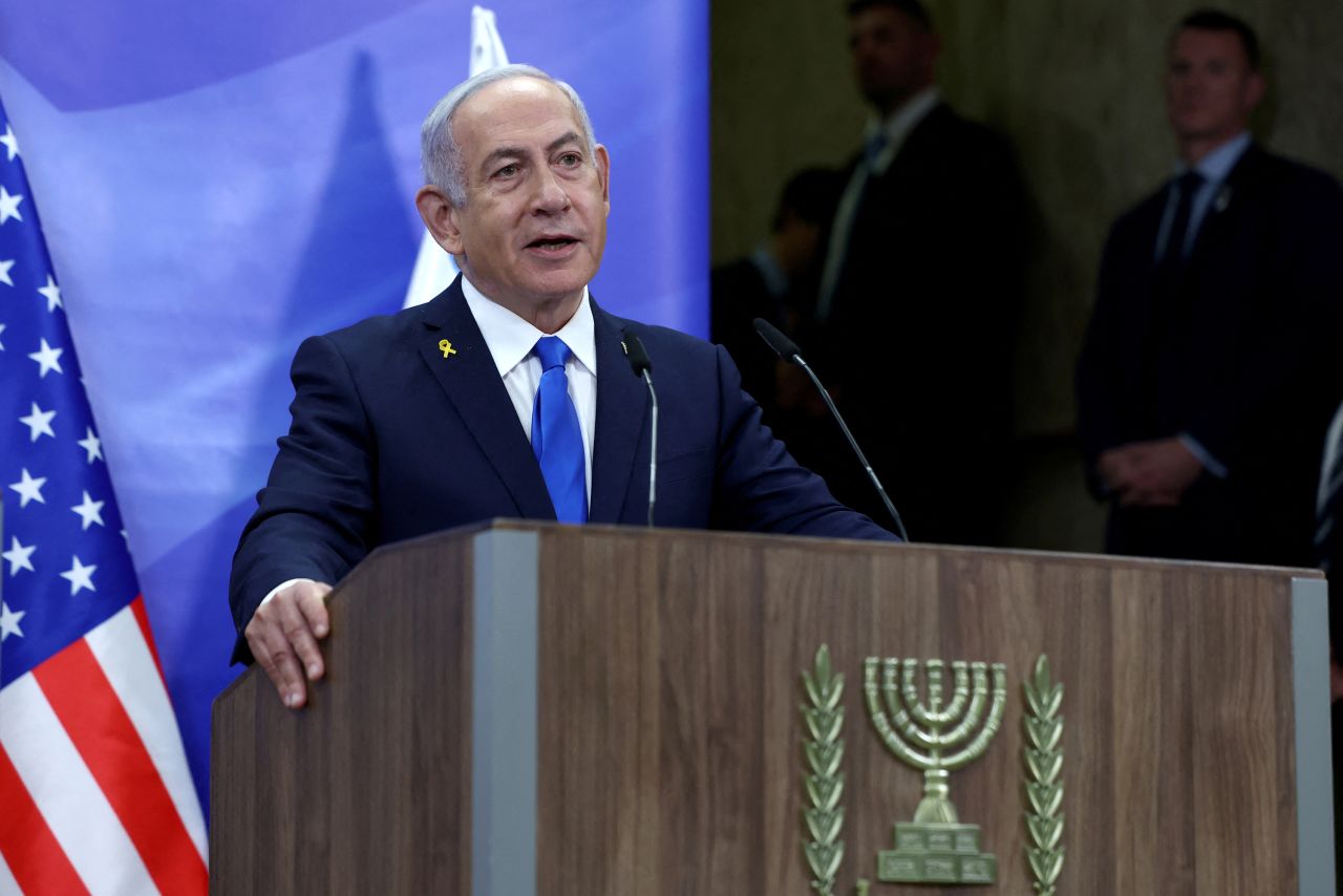 Israeli Prime Minister Benjamin Netanyahu speaks to the press in Jerusalem on Sunday. The International Criminal Court issued an arrest warrant for Netanyahu in November. He remains wanted for war crimes and crimes against humanity.