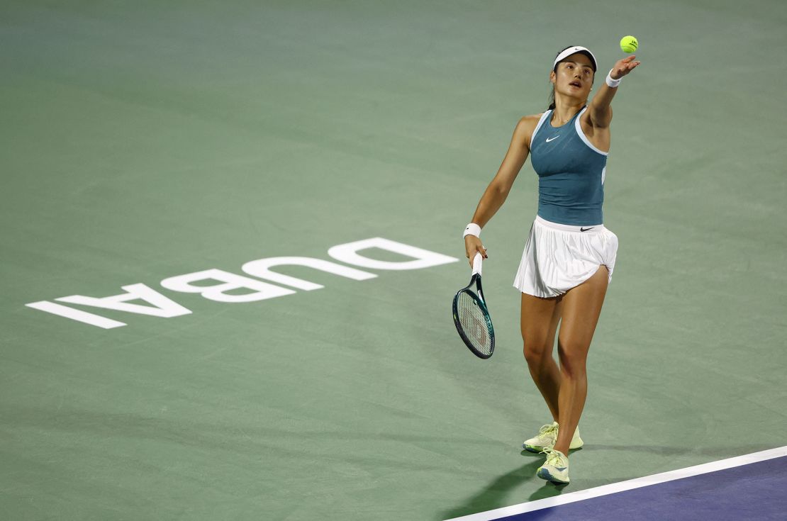 Raducanu plays a serve against Greece's Maria Sakkari in the first round of the Dubai Tennis Championships.