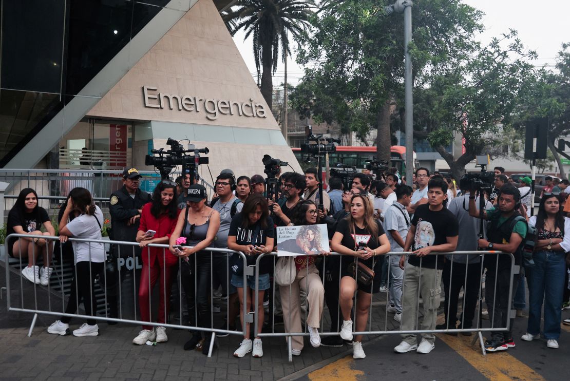 A fan pictured holding a poster of Shakira in Lima, Peru, after the singer was hospitalized.