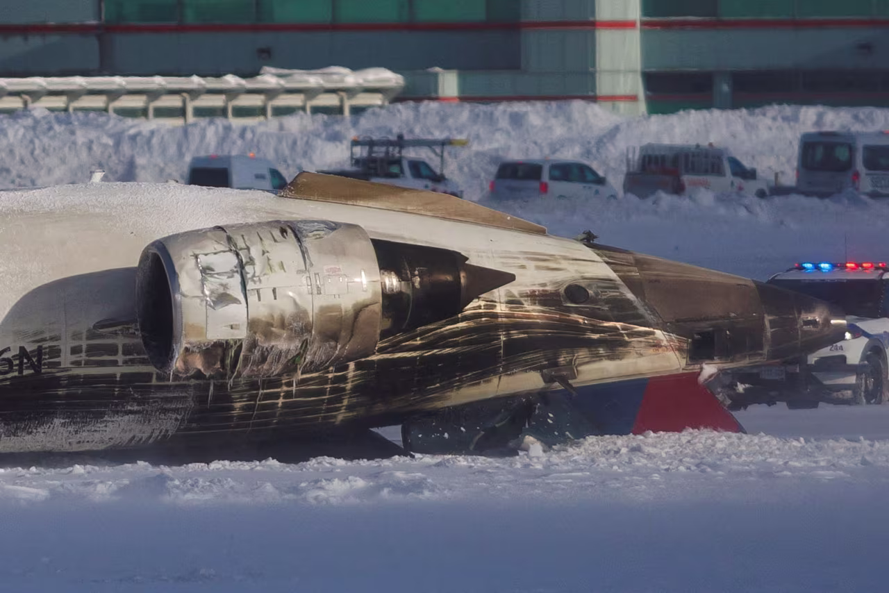 Damage to the plane is seen after the crash at Toronto Pearson Airport.