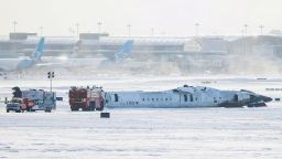 The wreckage of a Delta Air Lines-operated CRJ900 aircraft lays on the runway after a plane crash at Toronto Pearson International Airport in Mississauga, Ontario, Canada February 18, 2025. REUTERS/Cole Burston