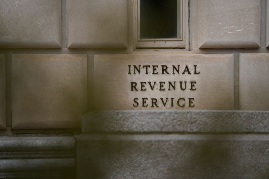A sign displaying the name of the International Revenue Service Building is seen in Washington, DC on February 18.