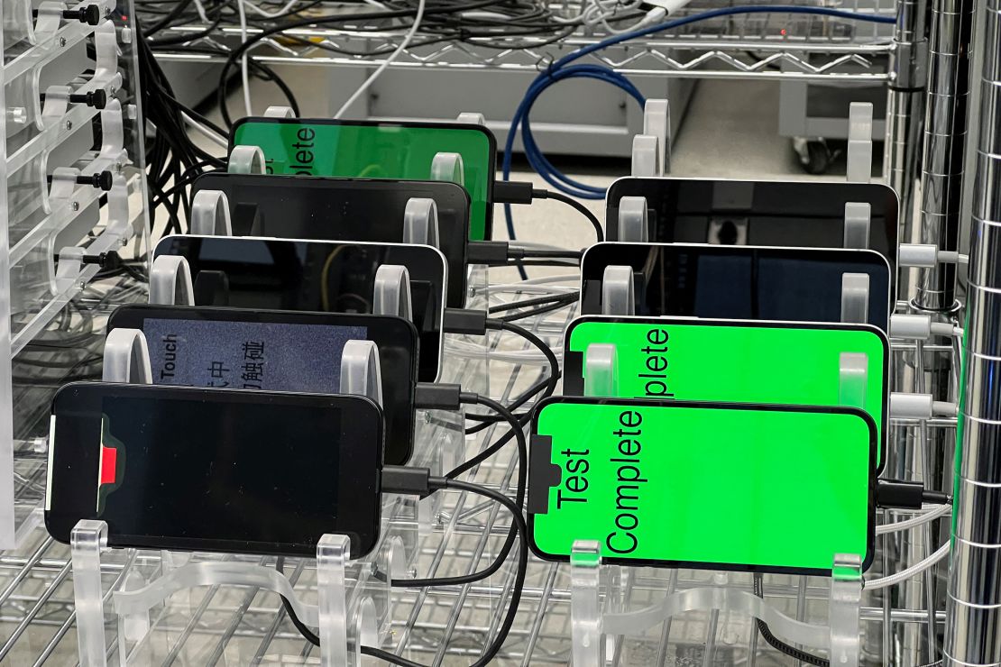 Multiple iPhone 16e phones with the new C1 cellular modem are stress tested at an Apple lab in Sunnyvale, California, on February 18, 2025.