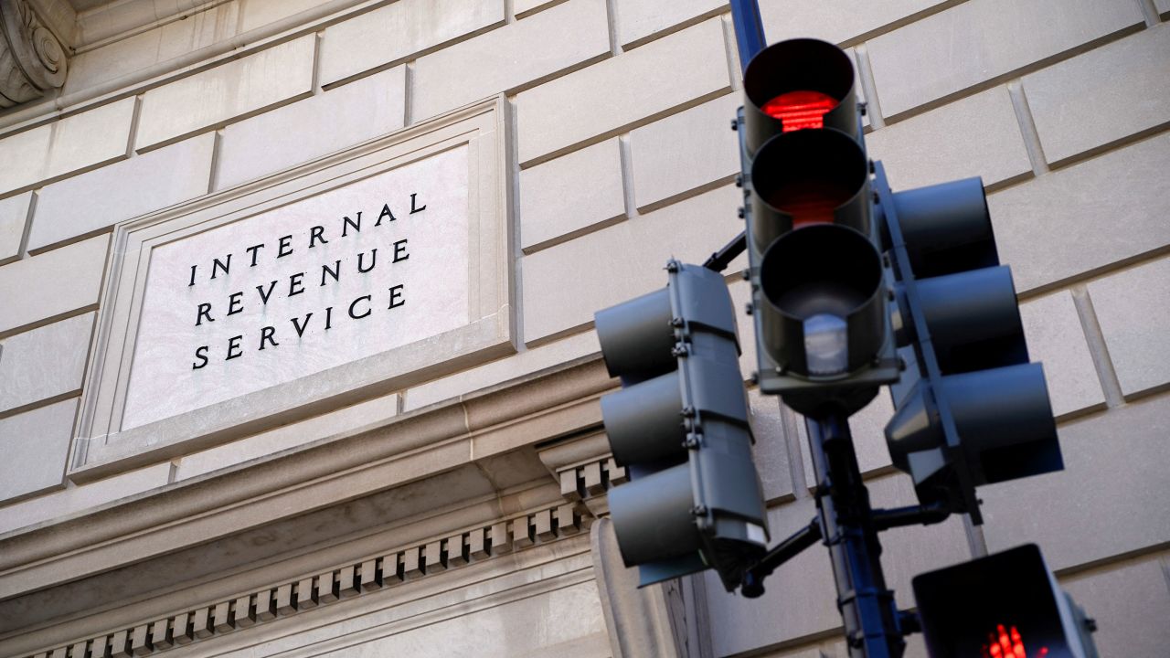 A traffic light is red outside the U.S. Internal Revenue Service building in Washington, DC, on February 20, 2025.