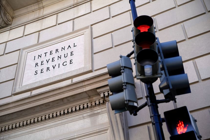A traffic light is red outside the U.S. Internal Revenue Service building in Washington, DC, on February 20, 2025.