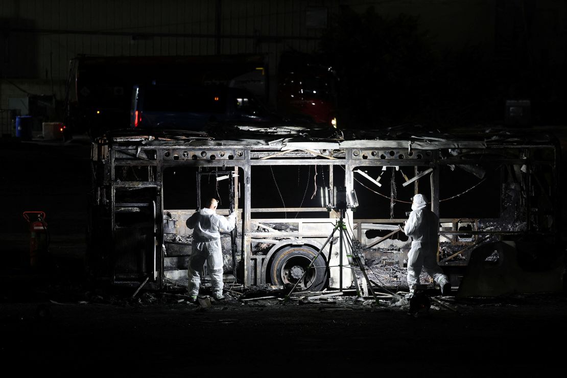 Forensics personnel inspect a bus following an explosion in Bat Yam on February 20, 2025.