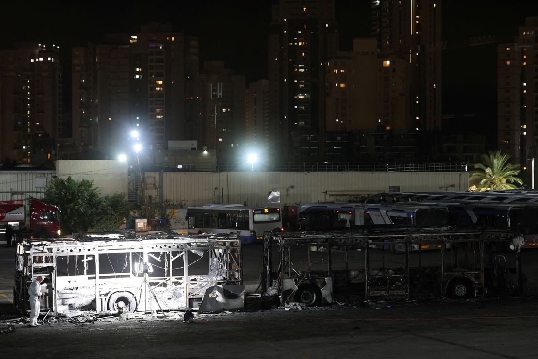 Forensics personnel inspect a bus following an explosion in Bat Yam on February 20, 2025.