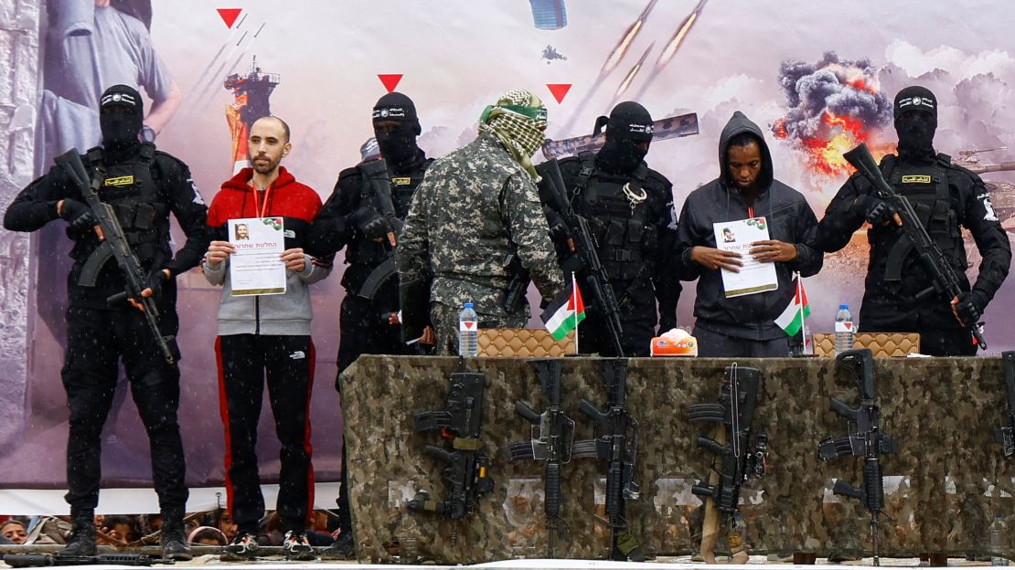 Avera Mengistu and Tal Shoham are brought onto a stage before being released by Hamas in Rafah, in the southern Gaza Strip, on Saturday.