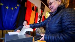 A woman votes at a polling station in a pub during the 2025 general election, in Berlin, Germany, on February 23, 2025.