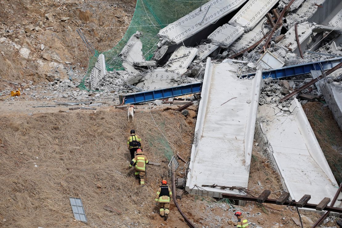 Rescue workers participate in a salvage operation at a collapsed highway construction site in Cheonan, South Korea, February 25, 2025