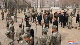 North Korean leader Kim Jong Un watches a cadet practicing on the parallel bars during his visit to the Kang Kon Military Academy, in Pyongyang, North Korea, February 25, 2025.