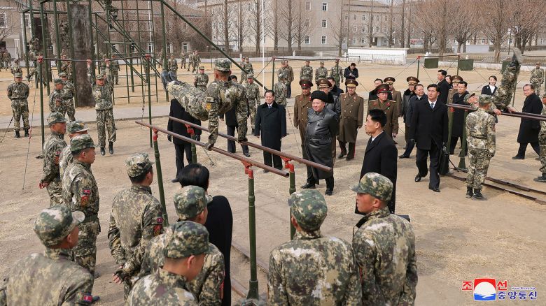 North Korean leader Kim Jong Un watches a cadet practicing on the parallel bars during his visit to the Kang Kon Military Academy, in Pyongyang, North Korea, February 25, 2025.