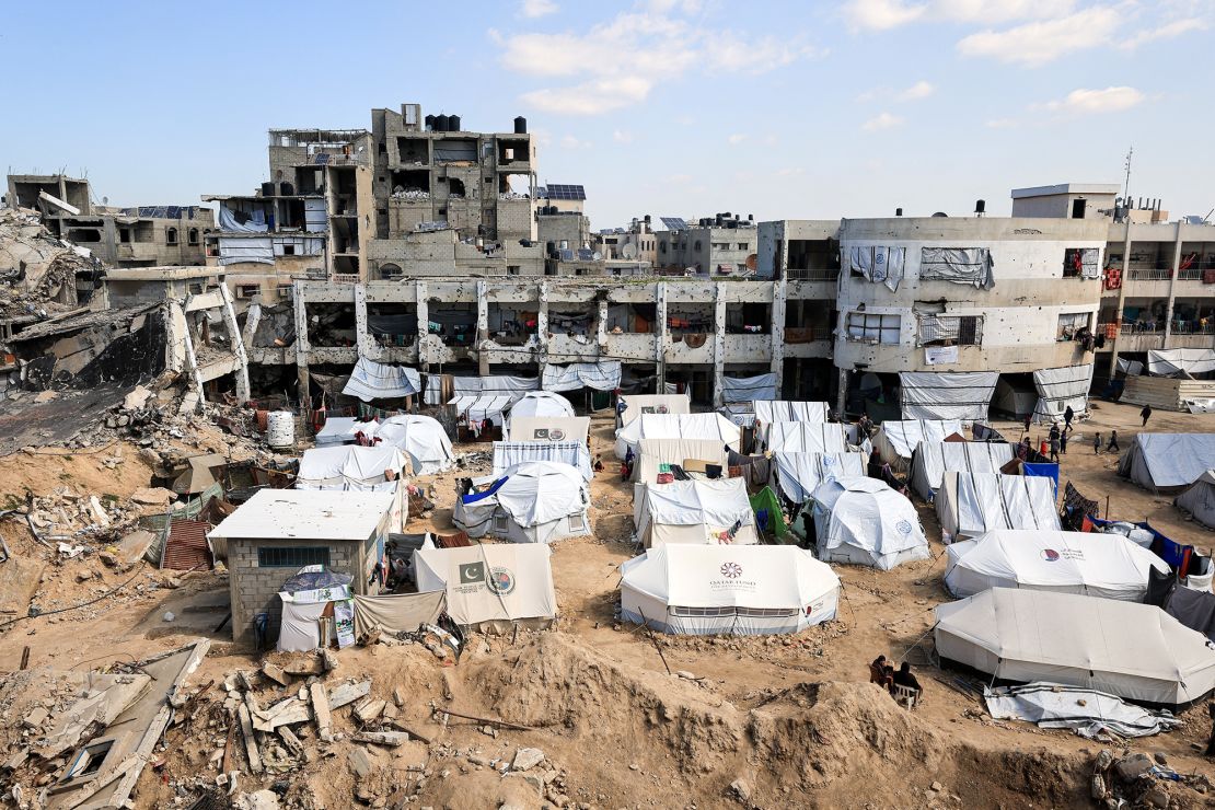 Palestinians sheltering in tents set up near the rubble of buildings, in Gaza City, February 26.