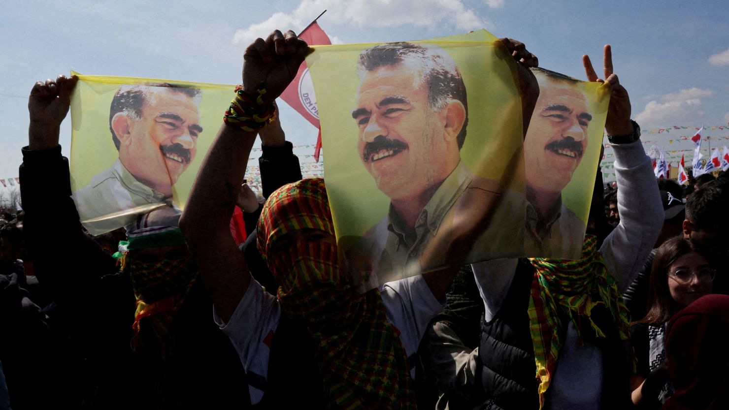 Supporters of pro-Kurdish Peoples' Equality and Democracy Party display flags with a portrait of jailed Kurdistan Workers Party leader Abdullah Ocalan during a rally in Istanbul, Turkey, in March 2024.