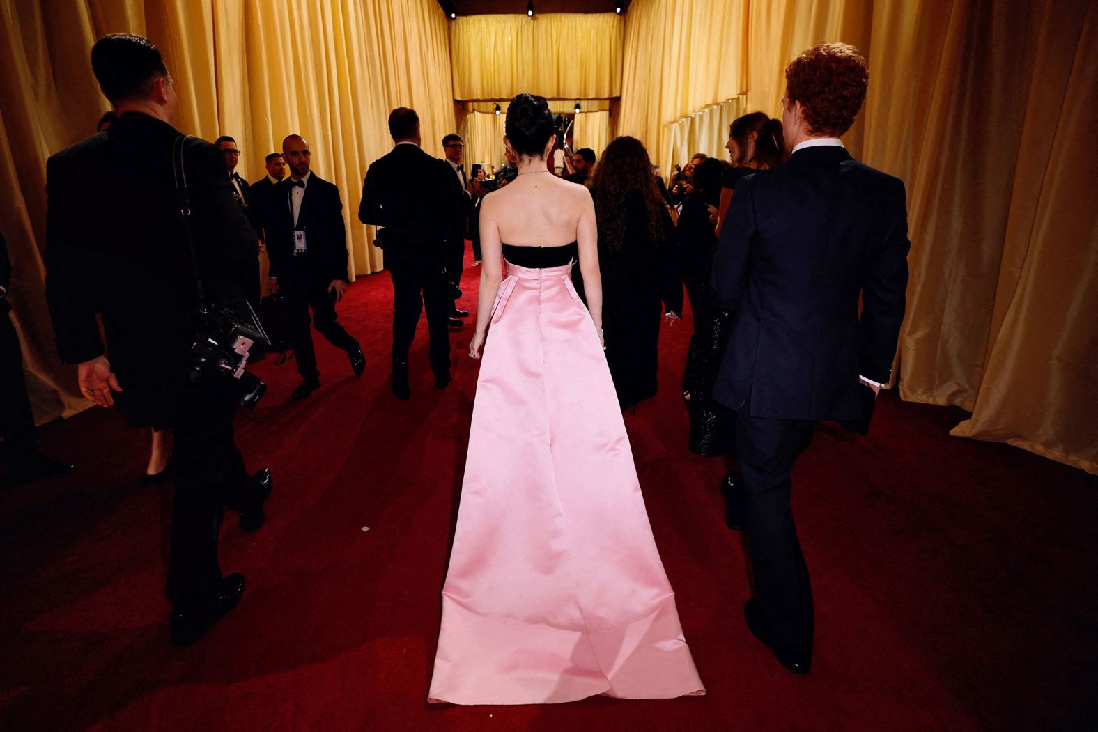 Madison walks down the red carpet before the show. <a href="https://www.cnn.com/2025/03/02/style/red-carpet-looks-oscars/index.html">See the best red carpet looks</a>.