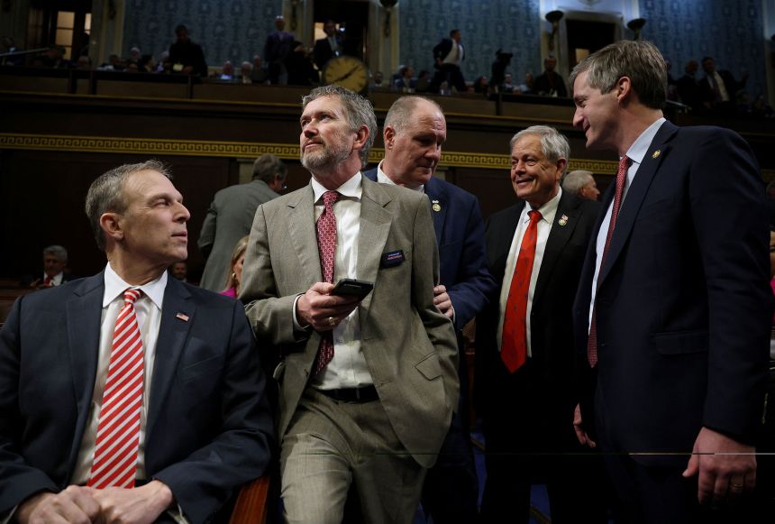 Rep. Thomas Massie, center, stands among lawmakers ahead of President Donald Trump’s address to a joint session of Congress in March.