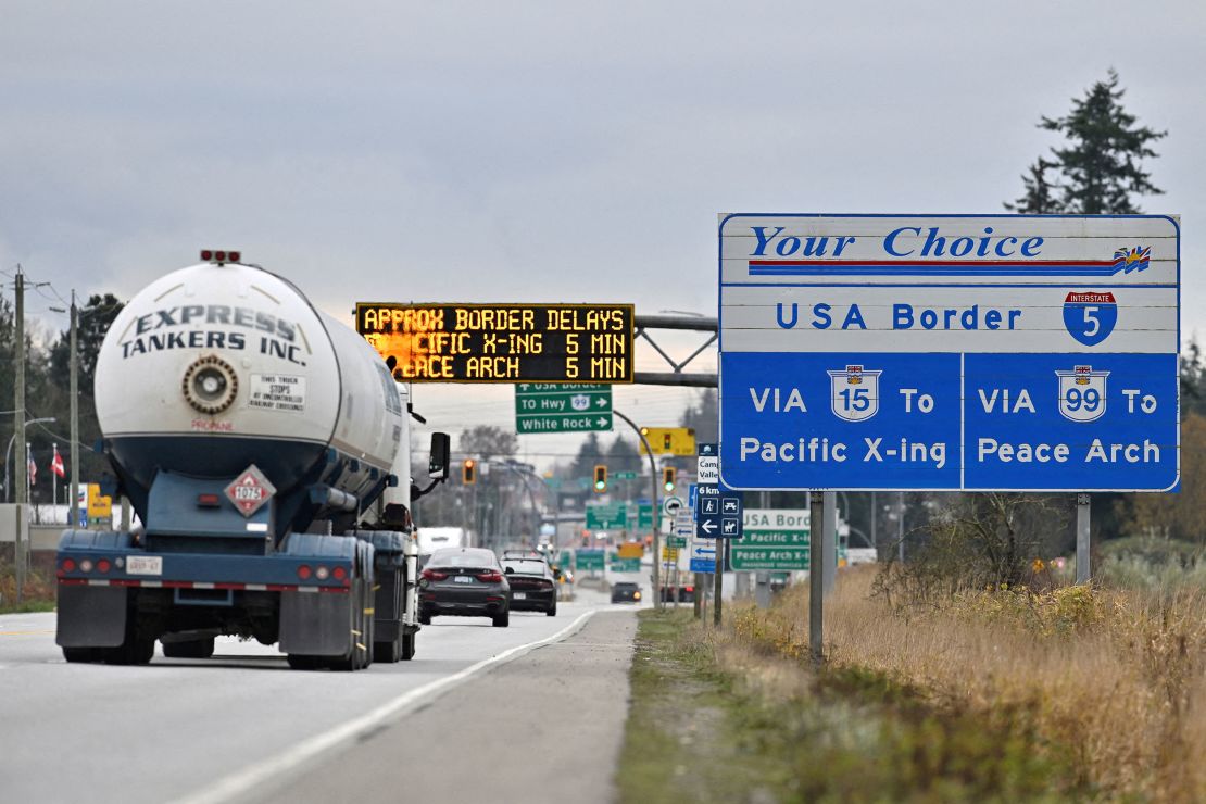 Commercial trucks head towards the US Customs and Border Protection Pacific Highway Port of Entry from south Surrey, British Columbia, Canada, November 26, 2024.