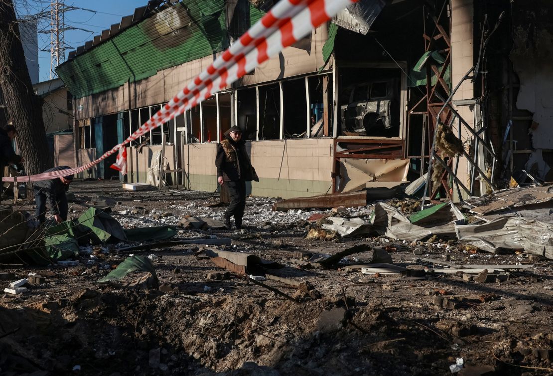 A resident walks past the site of a Russian drone strike, amid Russia's attack on Ukraine, in Odesa, Ukraine, on Saturday.