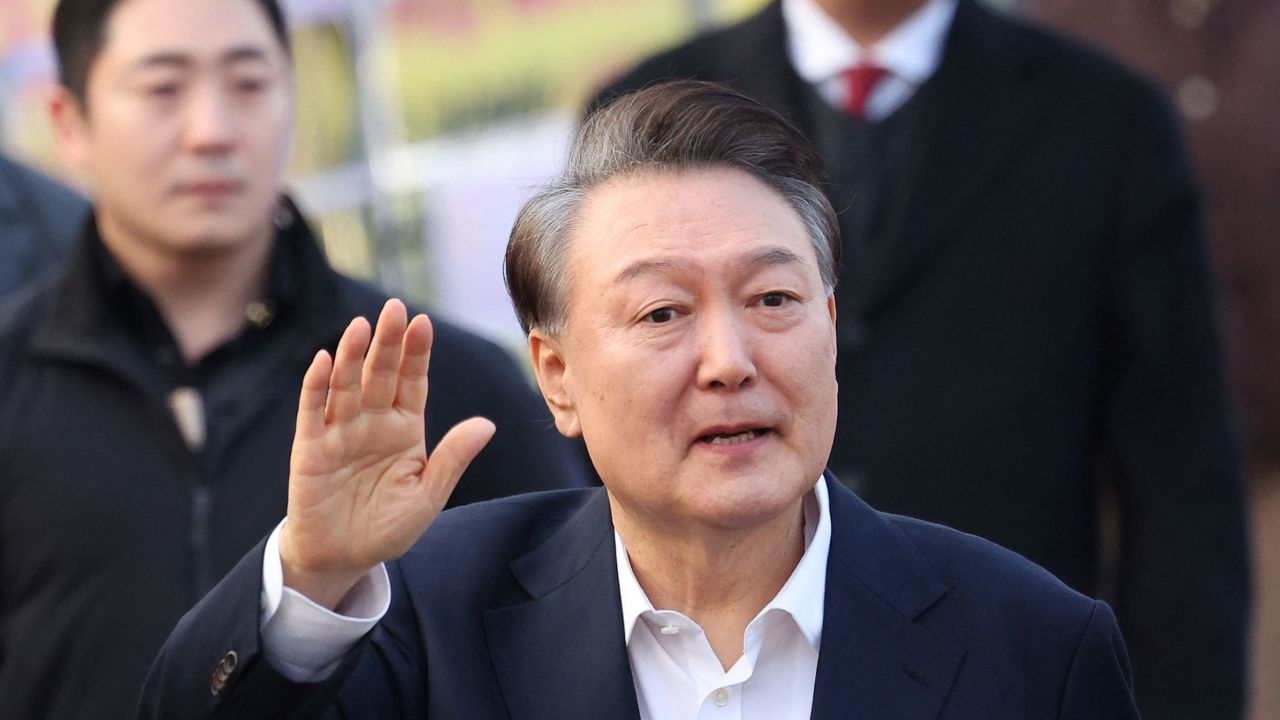 South Korean impeached President Yoon Suk Yeol gestures outside the Seoul detention center after his release, in Uiwang, South Korea, on March 8, 2025.