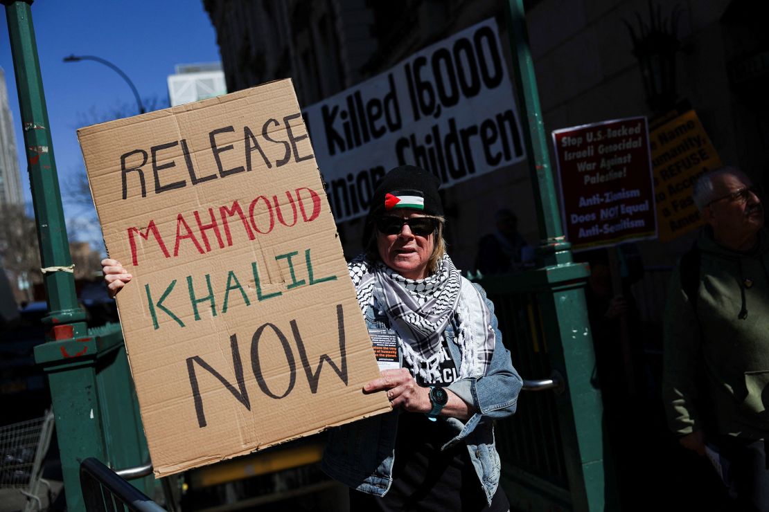 A person holds a sign during a protest following the arrest by U.S. immigration agents of Mahmoud Khalil.