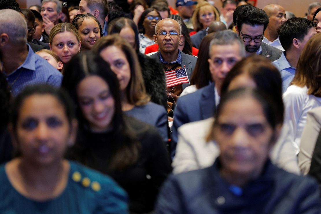 Immigrants wait for a naturalization ceremony at the John F. Kennedy Presidential Library in Boston, Massachusetts, on March 11. Attorneys say they expect more people to apply for citizenship amid growing uncertainty.