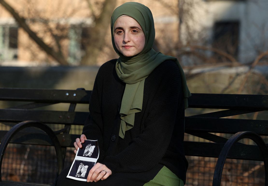 Noor Abdalla, wife of Mahmoud Khalil, holds an ultrasound photograph as she sits for a portrait in New York City on Wednesday.