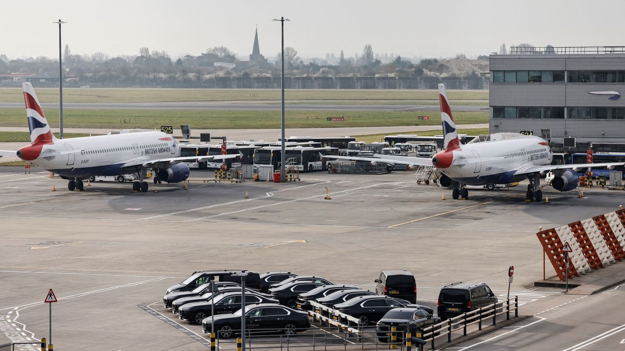 Airplanes remain parked on the tarmac at Heathrow International Airport after a fire at a nearby electrical substation wiped out the power at the airport, near London, Britain, March 21, 2025.
