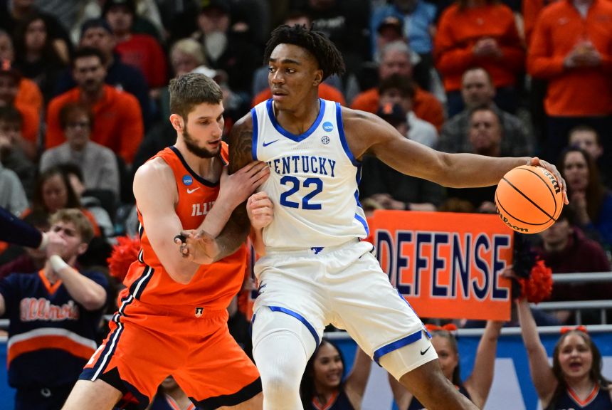 Williams, playing for the University of Kentucky, backs down an opposition player during March Madness.