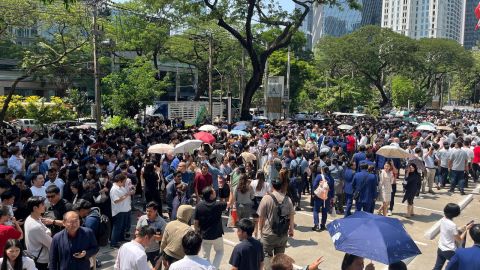 People gather on a street after a strong earthquake struck central Myanmar on Friday, earthquake monitoring services said, which affected Bangkok as well with hundreds of people pouring out of buildings in the Thai capital in panic after the tremors, in Bangkok, Thailand, March 28, 2025. REUTERS/Devjyot Ghoshal