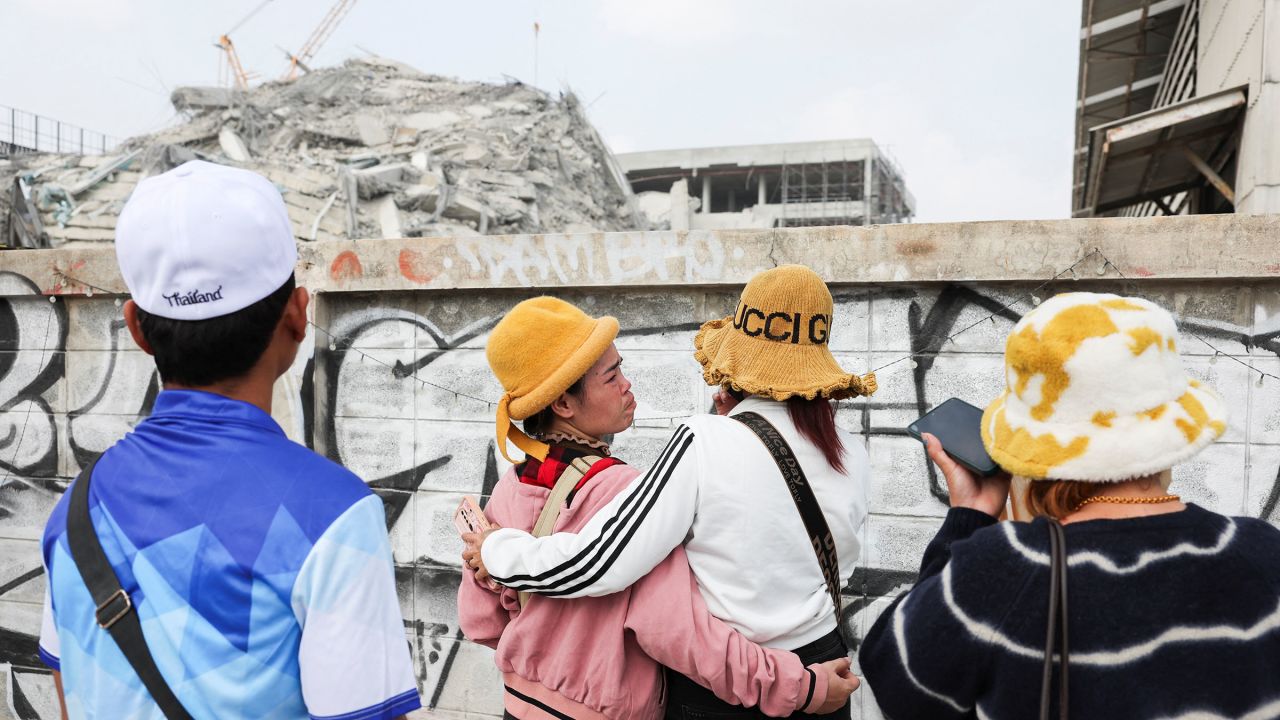 Den San, 33, a Cambodian migrant worker in Thailand for 18 years, reacts as she waits for an update on her brother, Soeurn Saan, 38, and his wife, who were working at the building at the time it collapsed following a strong earthquake, in Bangkok, Thailand, March 29, 2025.