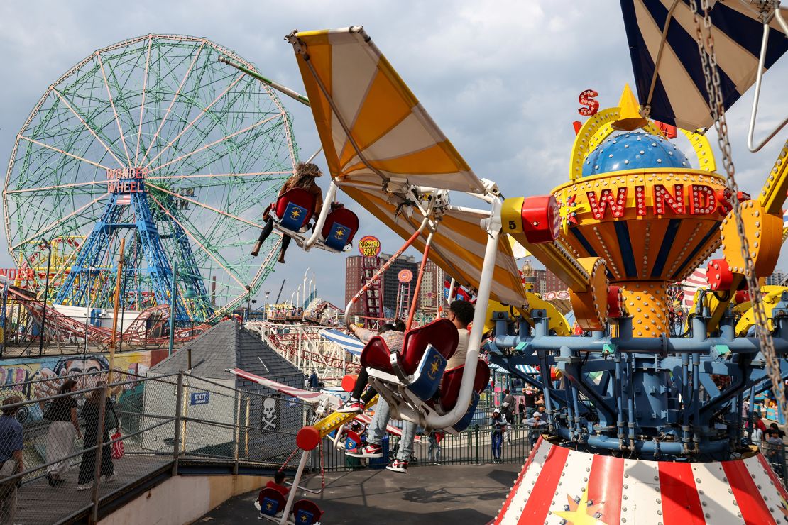 People ride attractions at Luna Park in Coney Island on the opening day of the season on March 29, 2025.