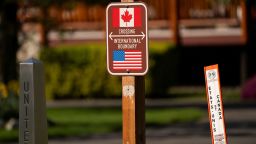 Signs mark the international boundary at a Canada-U.S. border crossing known as the Peace Arch Border Crossing, on the day U.S. President Donald Trump announced new tariffs, in Blaine, Washington, U.S. April 2, 2025.  REUTERS/David Ryder