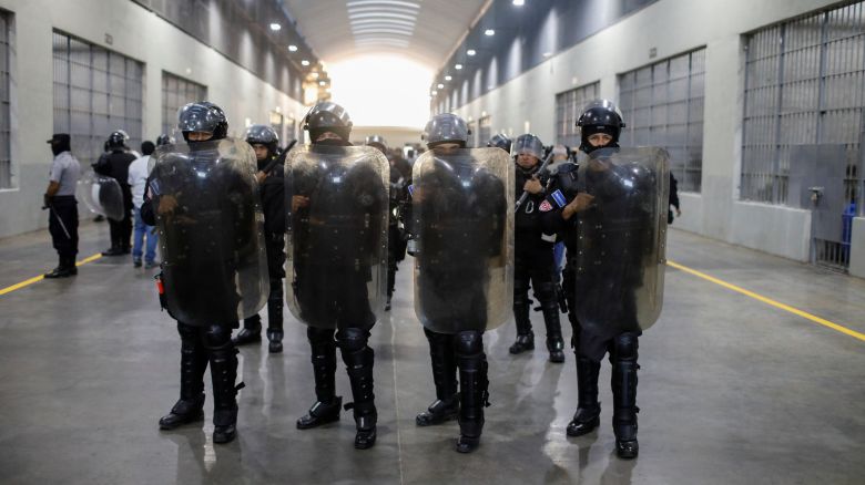 Police officers stand guard during a media tour at the Terrorism Confinement Center (CECOT) prison, in Tecoluca, El Salvador April 4, 2025.