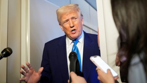 U.S. President Donald Trump talks to members of the press aboard Air Force One during a flight to Joint Base Andrews, Maryland, U.S., April 6, 2025. REUTERS/Kent Nishimura