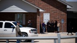 People stand outside of a Mennonite church after a funeral for an 8-year-old girl who died of measles in Seminole, Texas, U.S. April 6, 2025. Justin Rex for The Texas Tribune via REUTERS  
NO RESALES. NO ARCHIVES. MANDATORY CREDIT. THIS IMAGE HAS BEEN SUPPLIED BY A THIRD PARTY     TPX IMAGES OF THE DAY     