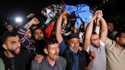 Palestinians carry the body of a Palestinian-American boy who was killed by Israeli forces in the village of Turmusaya, near Ramallah in the occupied West Bank on April 6, 2025.