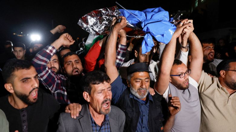 Palestinians carry the body of a Palestinian-American boy who was killed by Israeli forces in the village of Turmusaya, near Ramallah in the occupied West Bank on April 6, 2025.