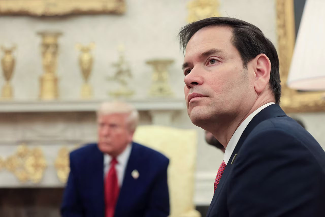 Secretary of State Marco Rubio sits with President Donald Trump during a meeting at the White House in Washington, DC on April 7.