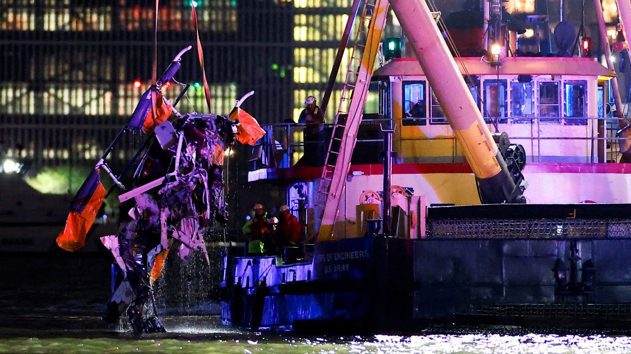 Emergency personnel work at the scene of a helicopter crash on the Hudson River near lower Manhattan in New York, as seen from Newport, New Jersey U.S., April 10, 2025.  REUTERS/Eduardo Munoz