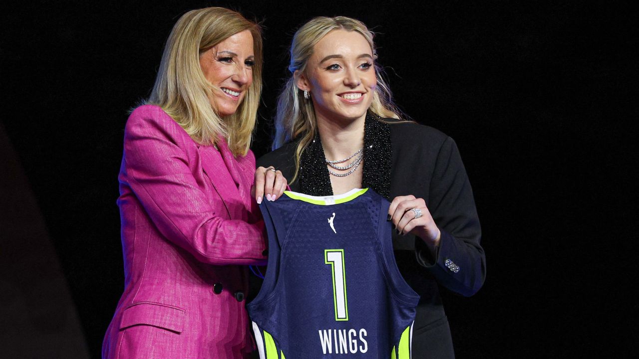 Paige Bueckers poses with WNBA commissioner Cathy Engelbert after being selected with the number one overall pick by the Dallas Wings in the 2025 WNBA Draft in New York.