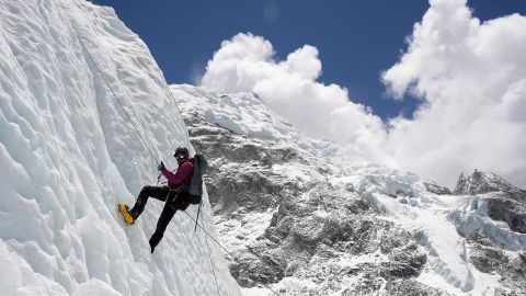 A mountaineer holds on to the rope during an ice climbing session at Everest base camp, Nepal, on April 15, 2025.