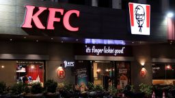 A security guard stands at the entrance of a Kentucky Fried Chicken outlet in Karachi, Pakistan, on April 16, 2025.