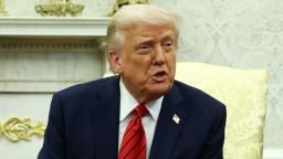 President Donald Trump answers questions from the press in the Oval Office at the White House in Washington, DC, on Thursday.