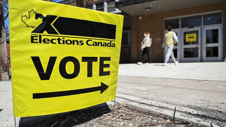 People arrive at a polling station during early voting for Canada's federal election in Montreal, Quebec, Canada, on April 20, 2025.