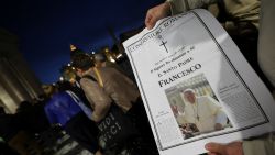 A person holds a "L'Osservatore Romano" newspaper with a picture of Pope Francis, following the death of the Pontiff, in the Vatican, April 21, 2025. REUTERS/Kai Pfaffenbach