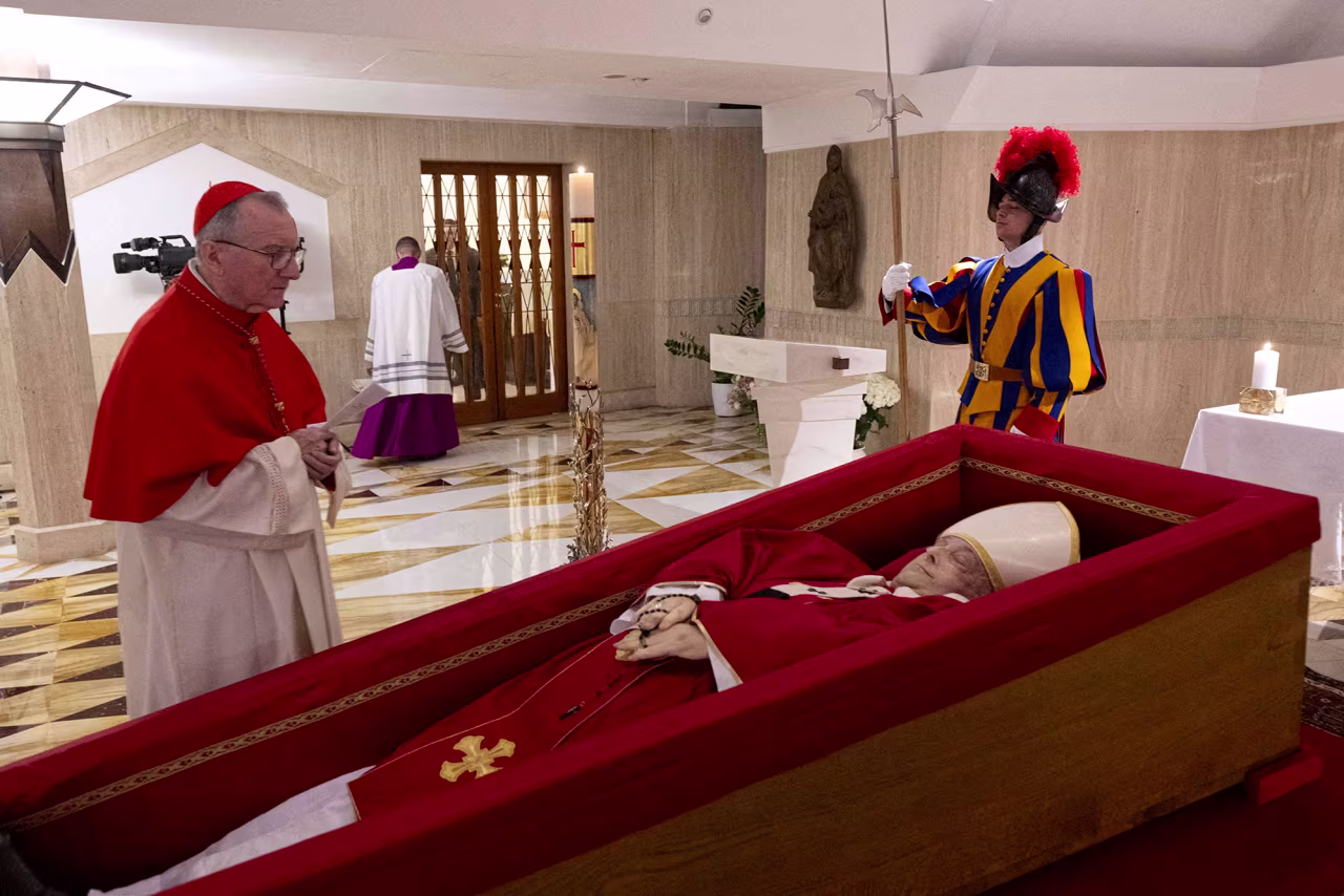Cardinal Pietro Parolin, the Vatican's secretary of state, stands near the body of Pope Francis, placed in an open coffin during the rite of the declaration of death in Santa Marta residence at the Vatican, on Tuesday..