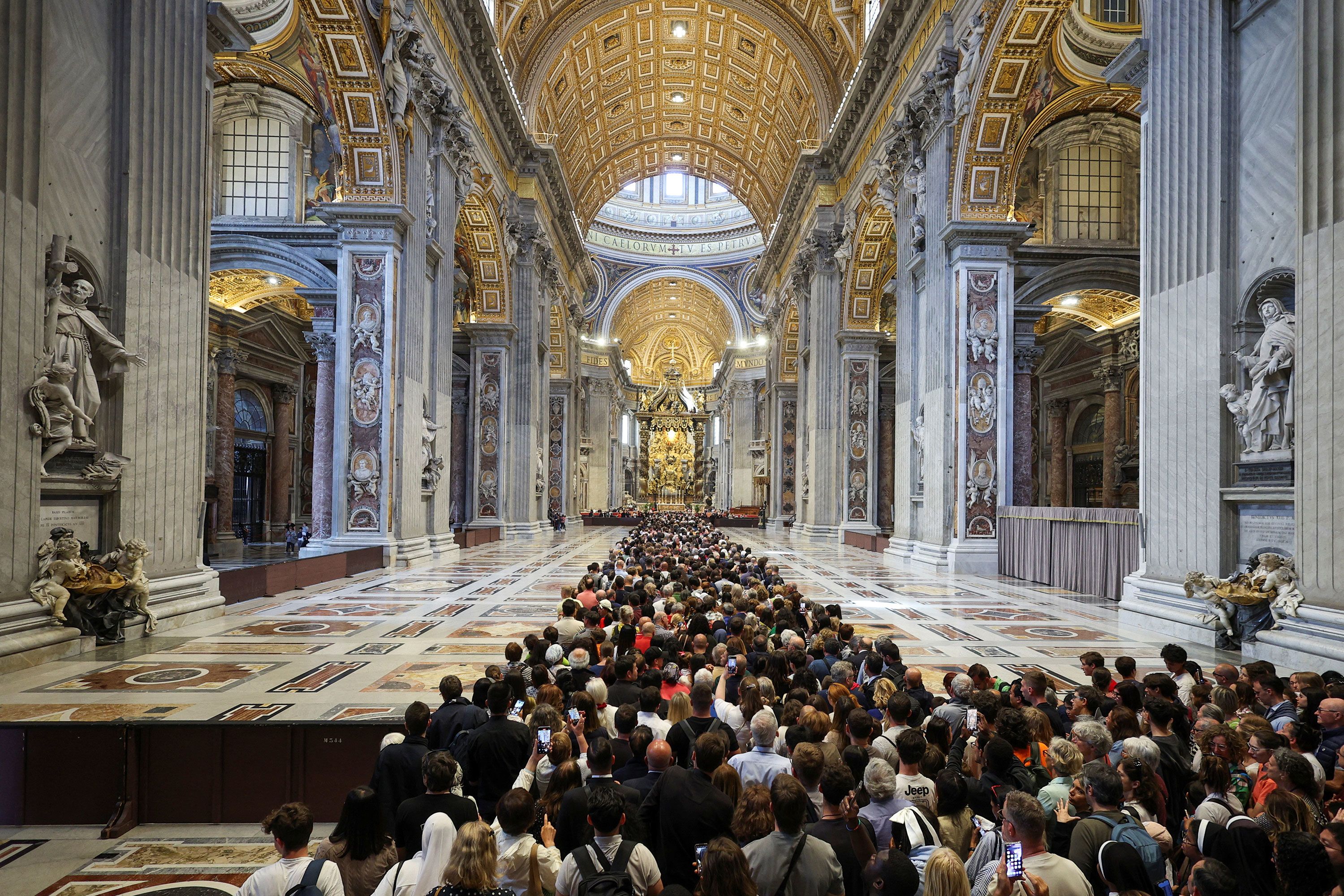 People wait to pay their respects as the pope's body lies in state in St. Peter's Basilica.